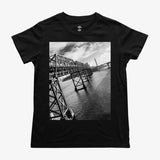 A close up of the picture of Oakland’s East Bay bridge on a women's black t-shirt..