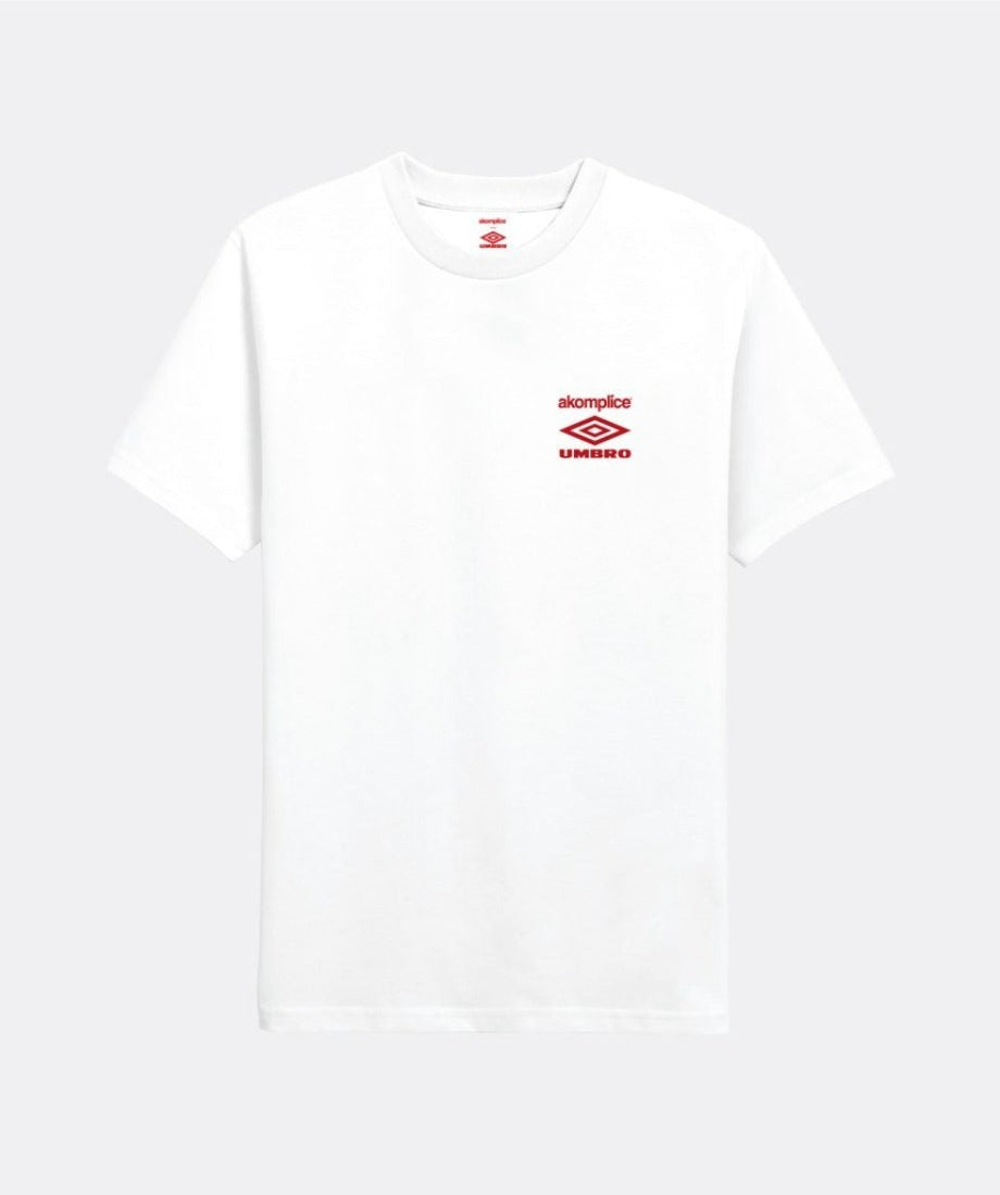 Front image of white Umbro short sleeve with embroidered 'Akomplice Umbro' on wearer's front left chest.