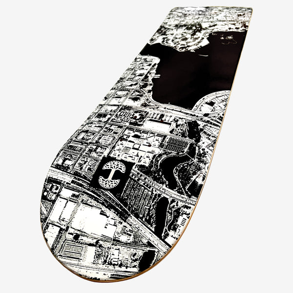 Detailed image of skate deck with an aerial view of  the center of Lake Merritt in black and white.