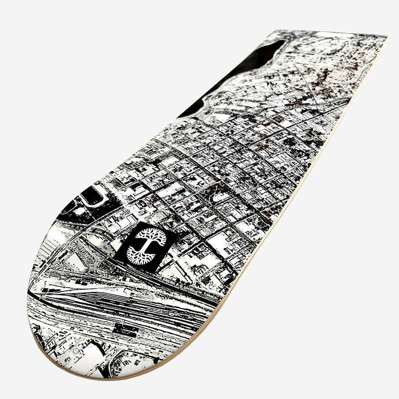 Skate deck with an aerial view photo of east of Lake Merritt and Oaklandish logo in black and white with Oaklandish logo.