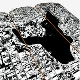 Close-up of black and white aerial image of Oakland and Lake Merritt on a skateboard deck.