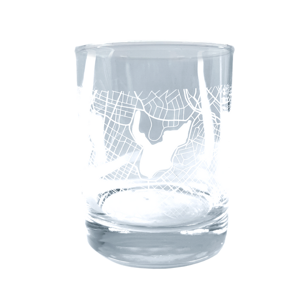 Clear glass whisky tumbler with an etched aerial map of Oakland.