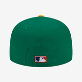 Backside of green New Era cap with red and blue national baseball league logo.