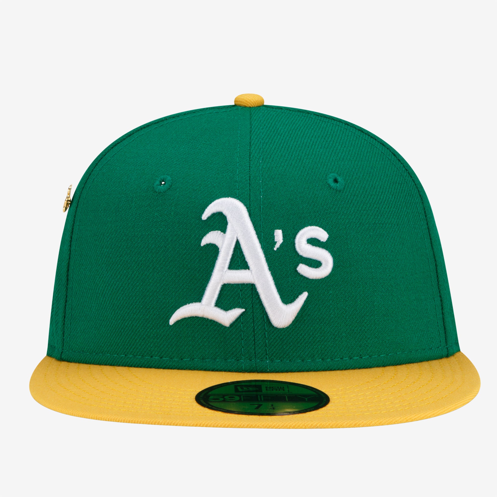 Green cap with embroidered Oakland As on crown, yellow bill with brand sticker.