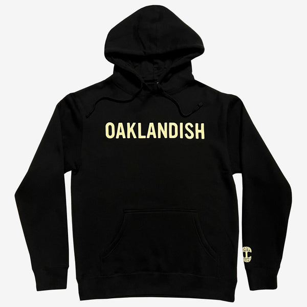 Black pullover hoodie with yellow Oaklandish wordmark on the chest and tree logo on bottom left wear side sleeve.