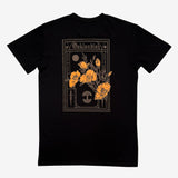 The back of a black cotton t-shirt with California poppies, an Oaklandish wordmark, and tree logo.