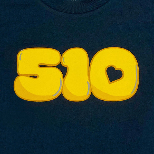 Detailed close-up of '510' graphic with the negative space in the '0' shaped like a heart on a navy toddler t-shirt.