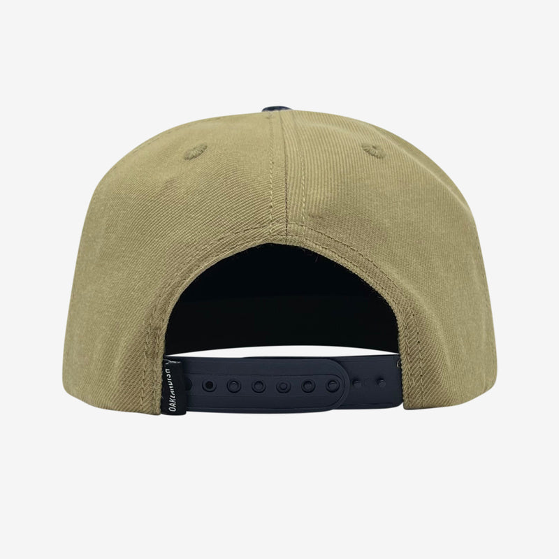 Back of tan hat with adjustable snapback and oaklandish tag.