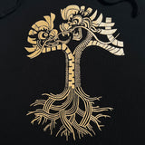 Close-up of metallic gold dragon power design in the shape of the Oaklandish tree logo on a black pullover hoodie.
