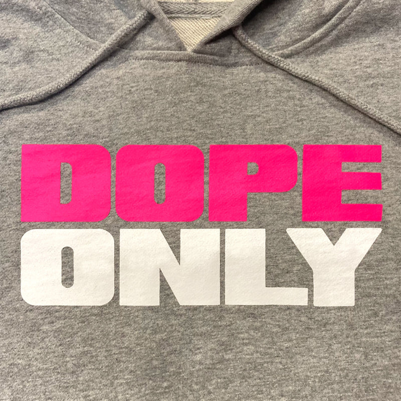 Close-up of pink and white 'Dope Only' wordmark centered across the chest of women's cropped athletic heather pullover hoodie.