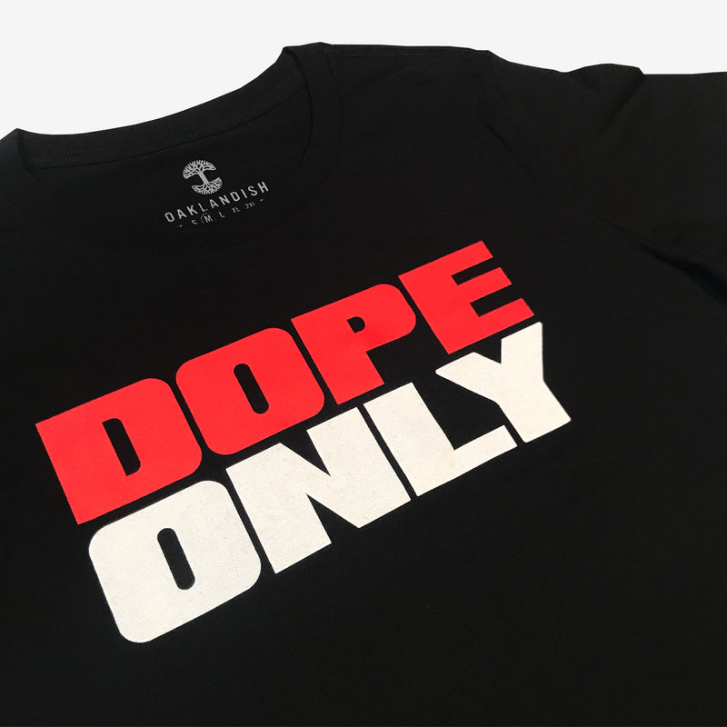 Close-up of large red and white DOPE ONLY wordmark logo on the chest of a black women’s t-shirt. 