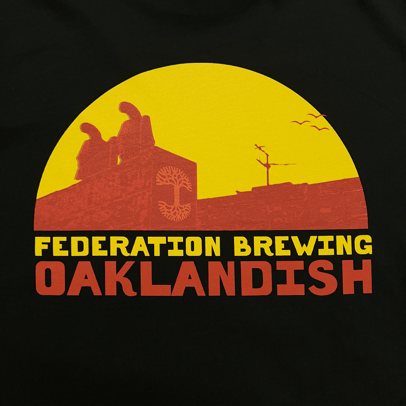 Detailed close-up of Federation of Brewing & Oaklandish collaborative orange and yellow graphic on the back of a black t-shirt.