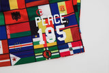Detailed close-up image of Nylon shorts with all over print of world flags and words that read ' Peace 195' at the bottom of wearers left lg.