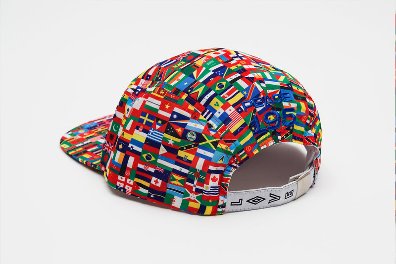 Back side of Nylon strap back hat with world flag print all over and embroidery that reads 'Peace 195' on back side and 'love' on adjustable strap.
