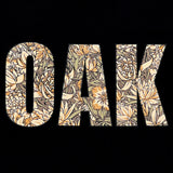 Detailed close-up image of men's bone t-shirt with floral pattern inside 'OAK' wordmark.