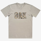 Front image of men's bone t-shirt with floral pattern inside 'OAK' wordmark.