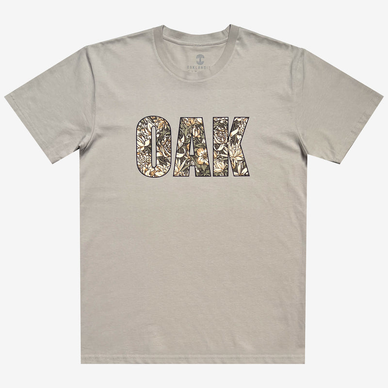 Front image of men's bone t-shirt with floral pattern inside 'OAK' wordmark.