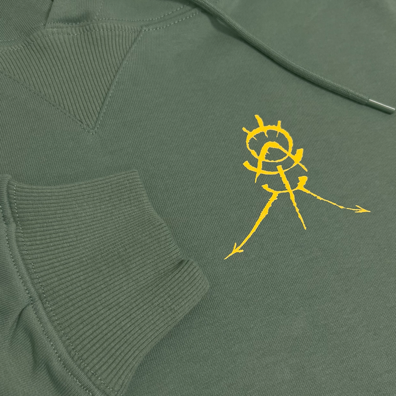 Detailed close up of an army green premium Oaklandish hoodie with GAT's OAK monogram on wearer's left chest and ribbing at cuff.