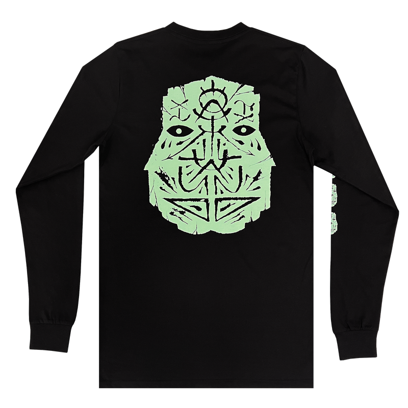 The backside of a black long sleeve t-shirt with a large teal GATS mask silhouette on the chest.