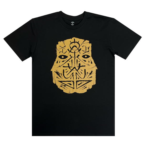 Front view of a black t-shirt with an oversized gold GATS mask silhouette on the chest.