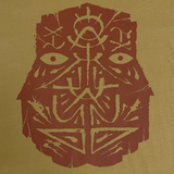 Detailed close-up of a dark brown GATS mask silhouette on the chest of a camel brown t-shirt.