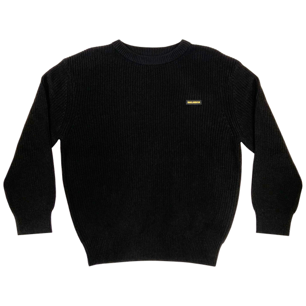 Heavy cotton knit sweater with embroidered Oaklandish wordmark woven label patch on front left chest in black.