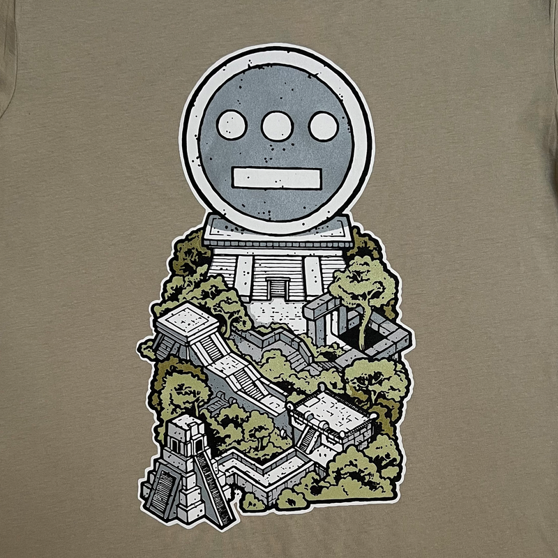 Detailed close-up of graphic of a Hiero hip hop logo resting ontop of an ancient ziggurat on a eucalyptus green t-shirt.
