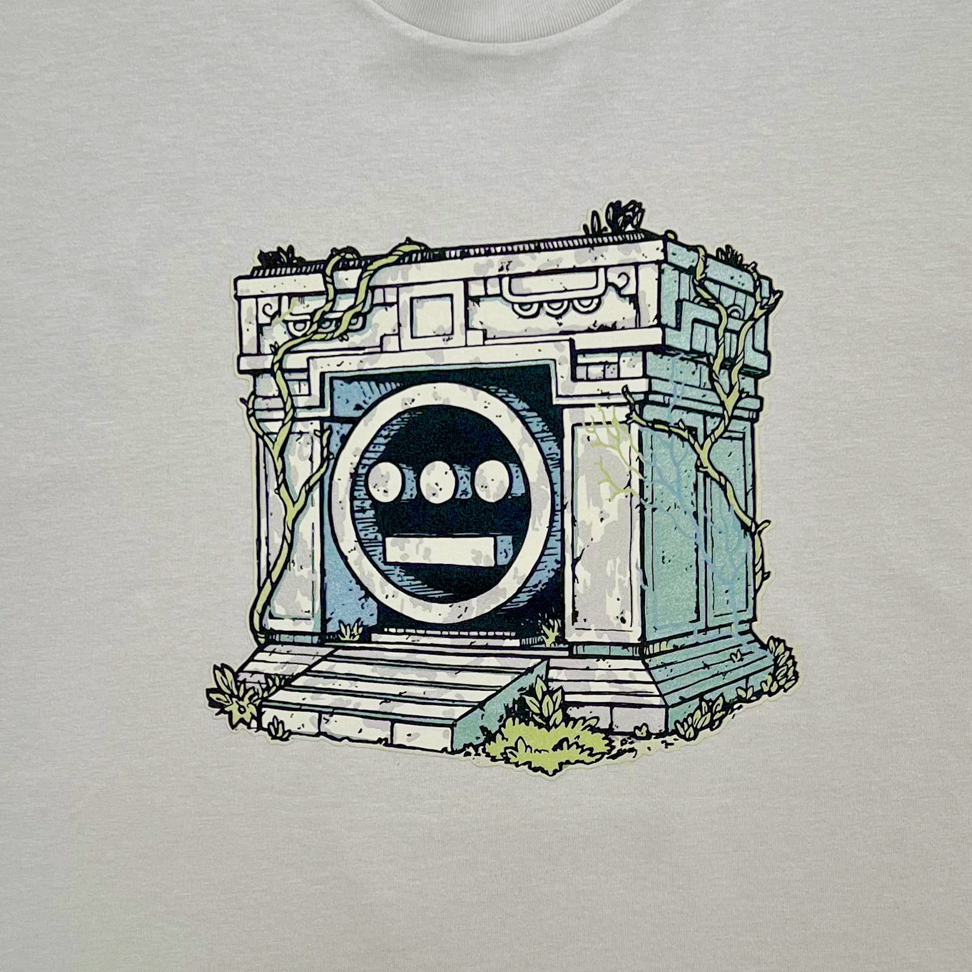Detailed close of a graphic illustration of a crypt with the Hiero hip-hop logo in the center on a bone t-shirt.