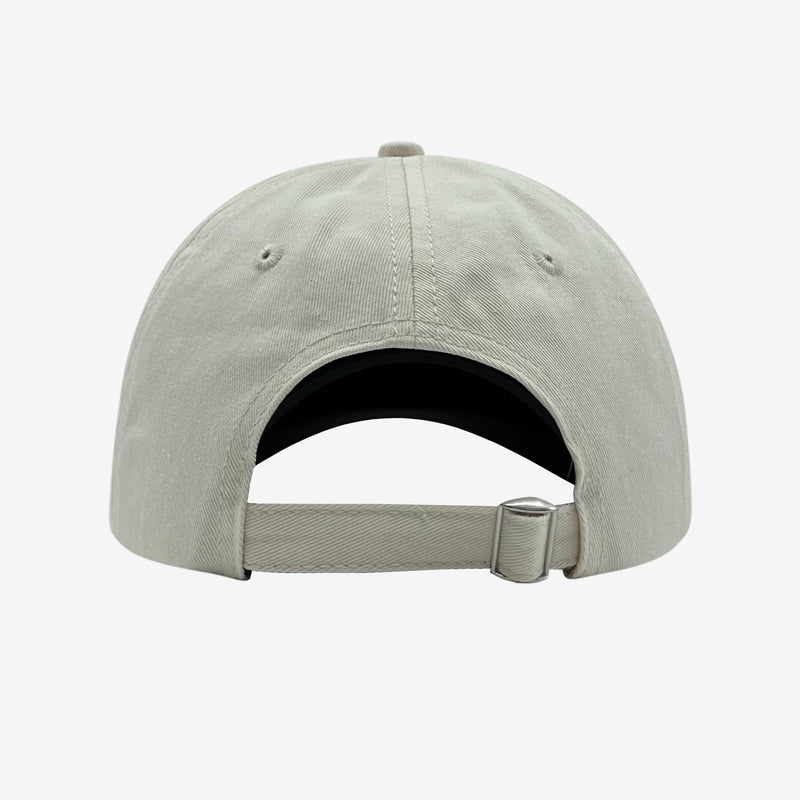 Back of cream dad cap with adjustable strapback.