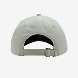 Back of cream dad hat with adjustable strapback.