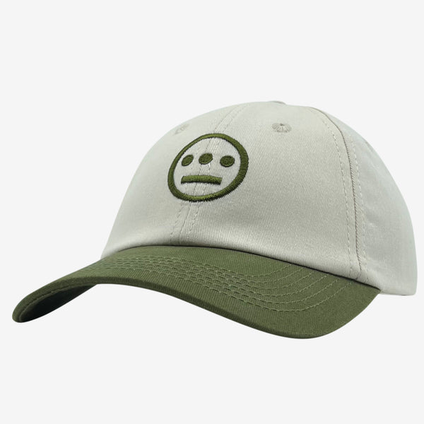 Side view of cream dad hat with olive embroidered Hiero hip-hop crew logo on crown and contrasting olive visor.