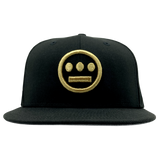Front view of black New Era fitted cap with gold embroidered Hiero hip-hop logo on the crown.