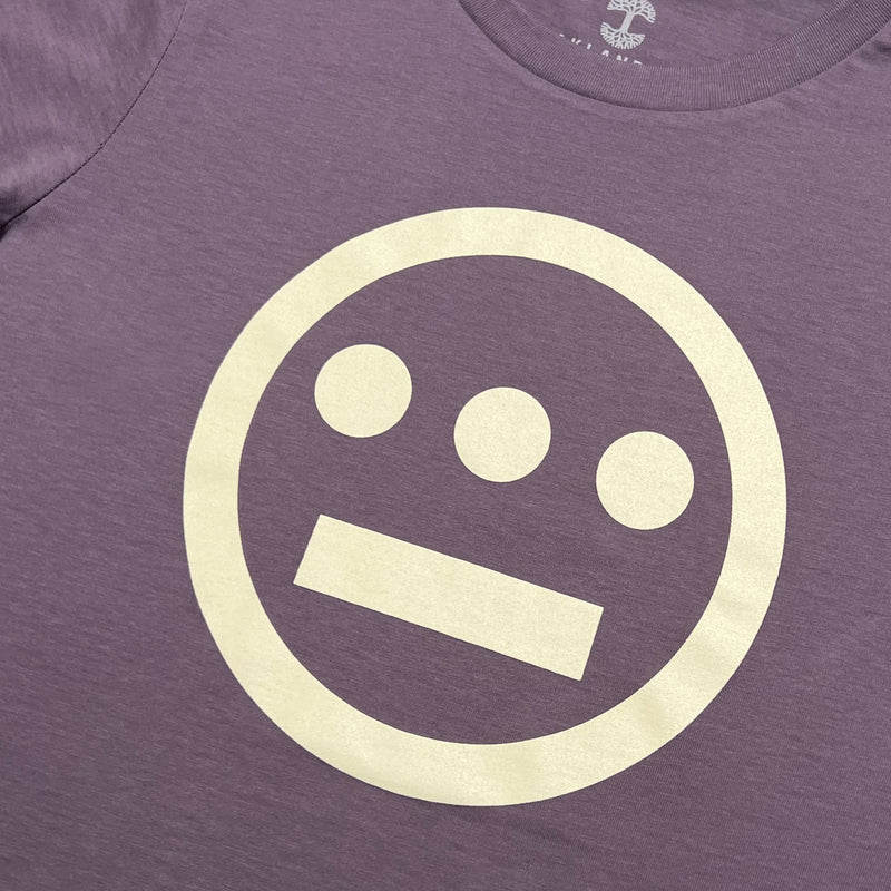 Close up of white Hieroglyphics Hip-Hop logo on a mauve t-shirt.