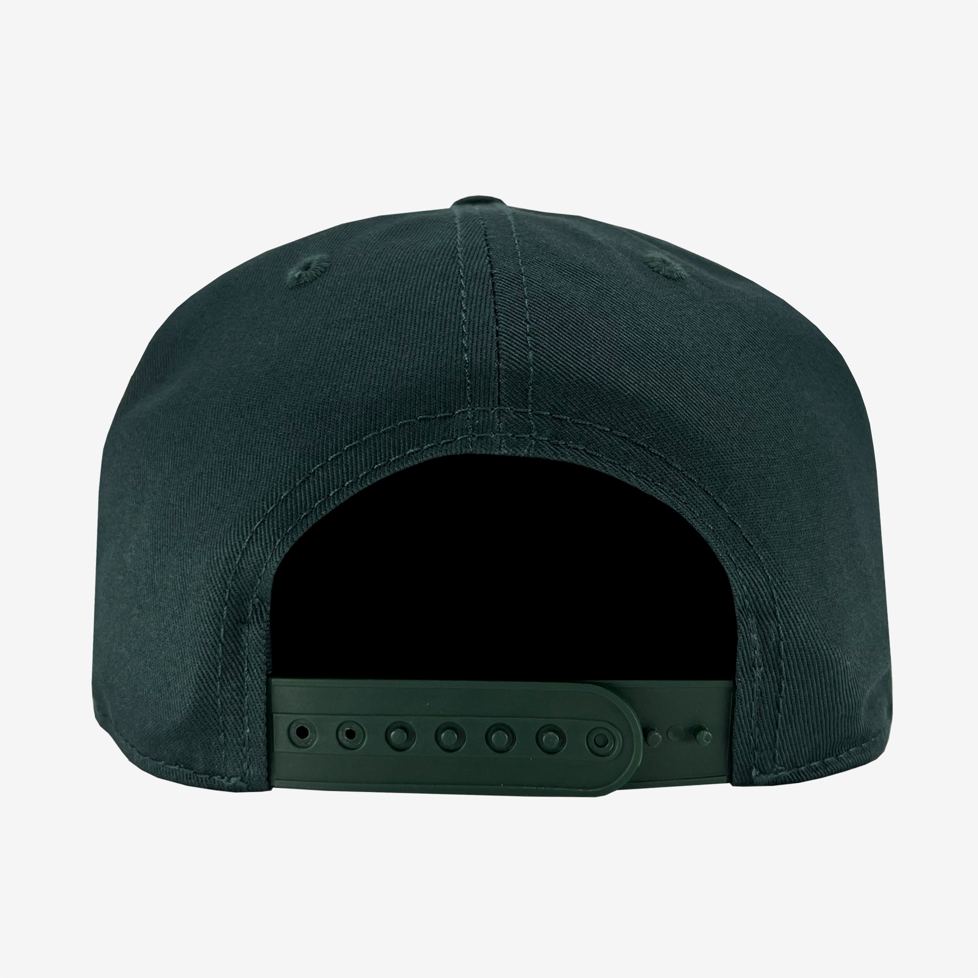 The image shows the back view of the Hiero Logo Snapback by Hieroglyphics, a dark green baseball cap with an adjustable closure. The headwear features a smooth, unadorned fabric surface and ventilation eyelets on both sides. The adjustment strap includes multiple holes for resizing.
