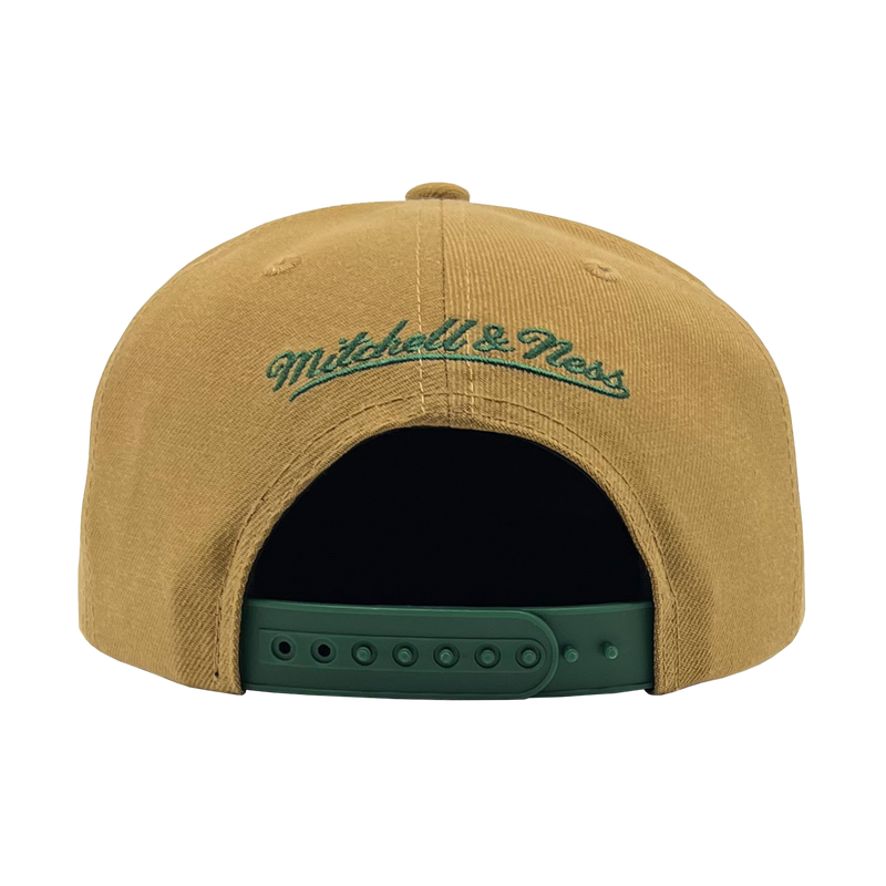 Back view of a brown snapback cap with green embroidered Mitchell & Ness wordmark. 