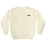 Heavy cotton white crew neck knit sweater with embroidered Oaklandish wordmark label on the front left chest.