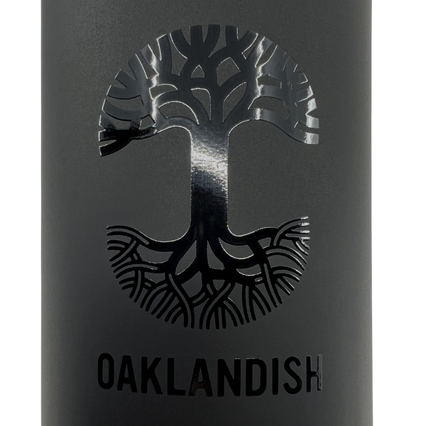 Detailed close-up of black Oaklandish tree logo and wordmark on a black 24oz water bottle.