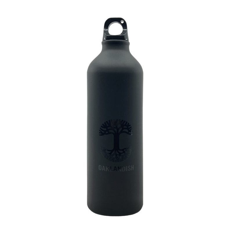 Black aluminum 24 oz water bottle with minimal black Oaklandish tree logo.