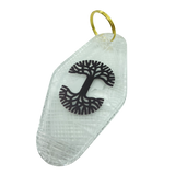Translucent white motel-style keychain with black Oaklandish Logo and Oakland aerial view map.