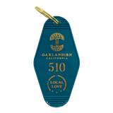  Blue vintage motel-style keychain with gold Oaklandish Logo and wordmark and 510 local love logo.
