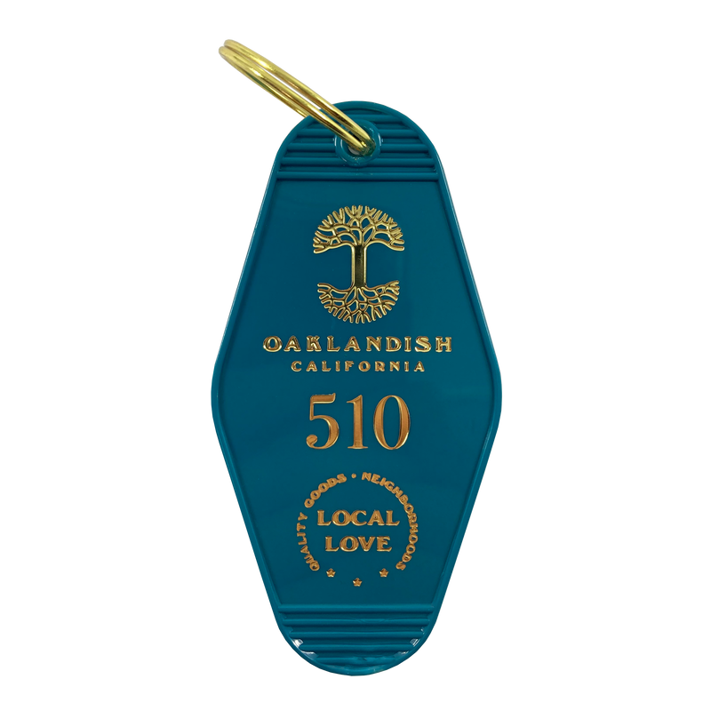  Blue vintage motel-style keychain with gold Oaklandish Logo and wordmark and 510 local love logo.