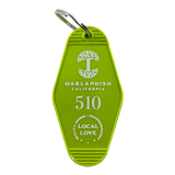 Lime green vintage motel-style keychain with gold Oaklandish Logo and wordmark and 510 local love logo.