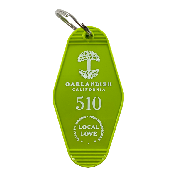Lime green vintage motel-style keychain with gold Oaklandish Logo and wordmark and 510 local love logo.
