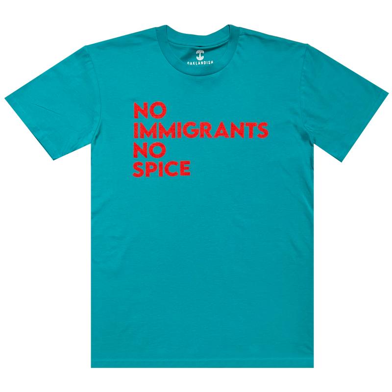 Teal t-shirt with No Immigrants No Spice wordmark printed in bright red on the front chest.