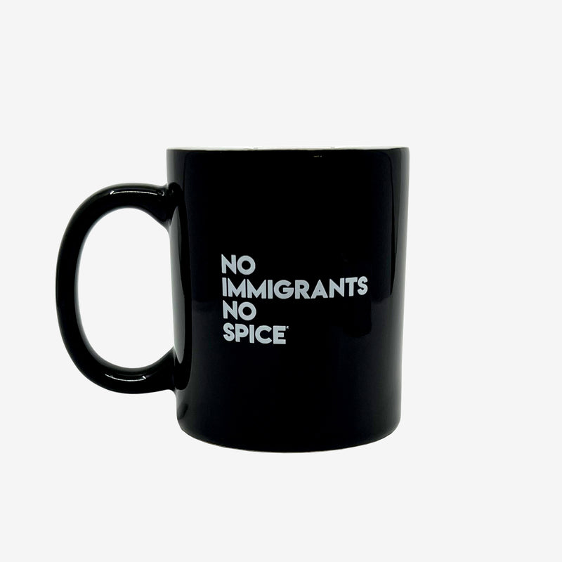 Glossy finish black ceramic coffee mug with white NO IMMIGRANTS NO SPICE wordmark.