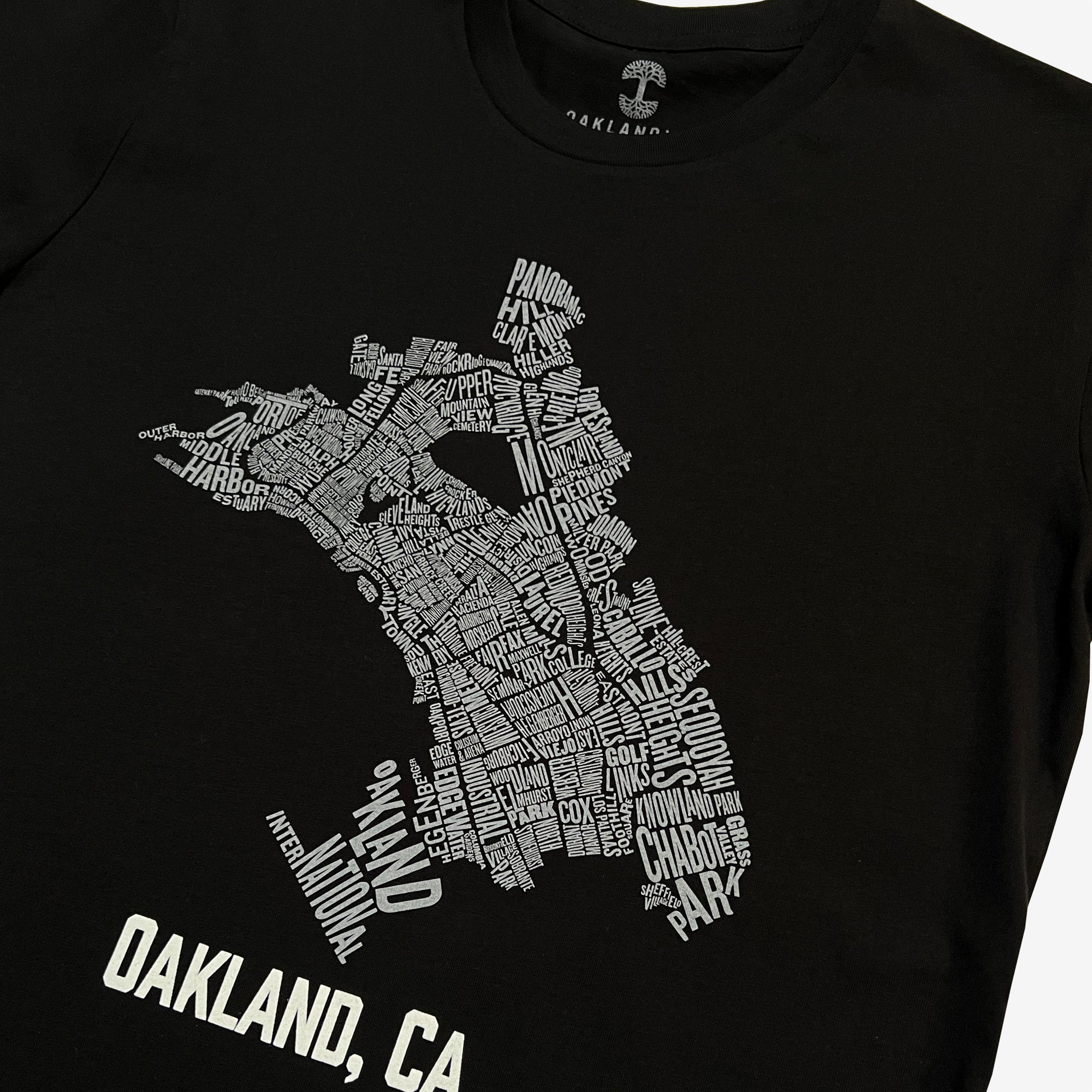 Close up of Oakland neighborhood map  with Oakland Nation & Oakland CA wordmarks on black t-shirt.