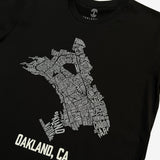 Close up of Oakland neighborhood map  with Oakland Nation & Oakland CA wordmarks on black t-shirt.