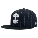 New Era 59FIFTY black pinstripe fitted hat with white embroidered Oaklandish tree logo-angled to show New Era logo on left wear side.