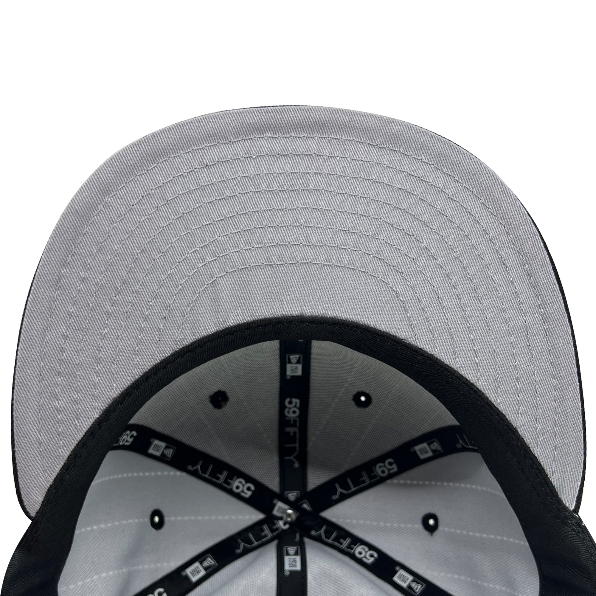 Inside the crown of New Era 9FIFTY fitted black pinstripe cap with black taping with New Era wordmark on repeat and grey under visor.