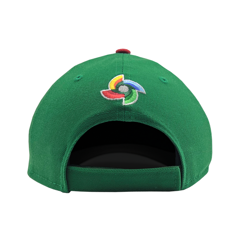 Backside view of green New Era adjustable cap with embroidered world baseball classic logo above the strap.